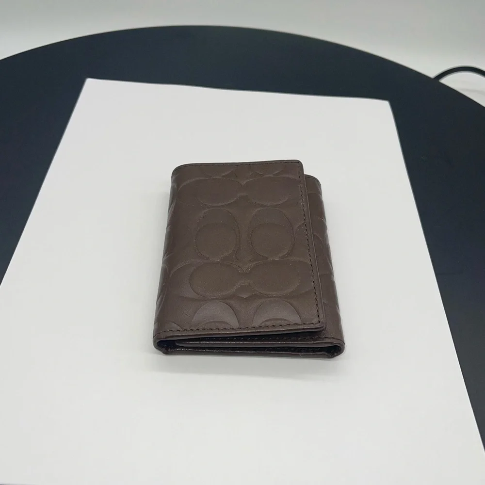 Coach Signature Embossed Trifold Wallet